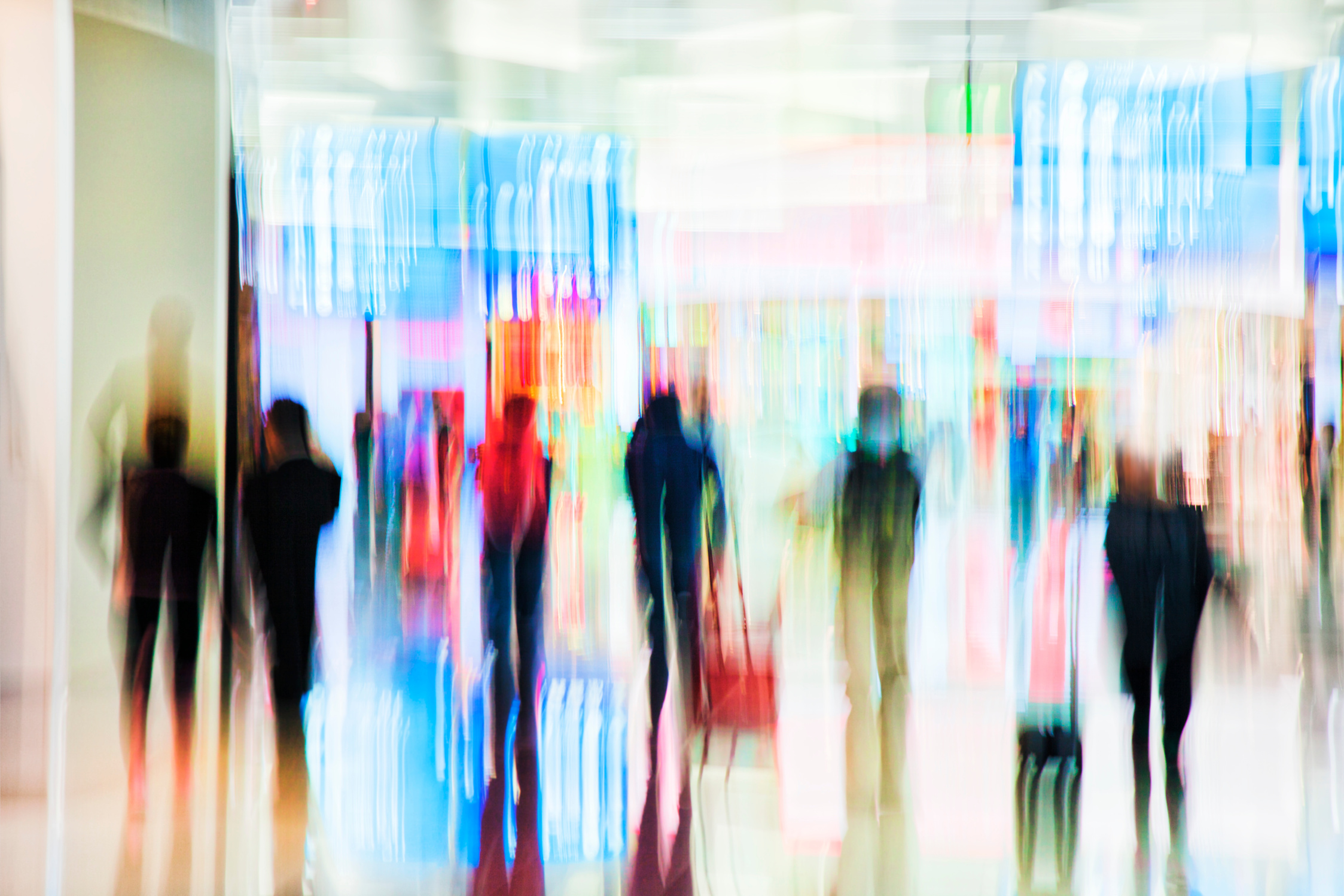 Motion Blurred Travellers Rushing at Airport
